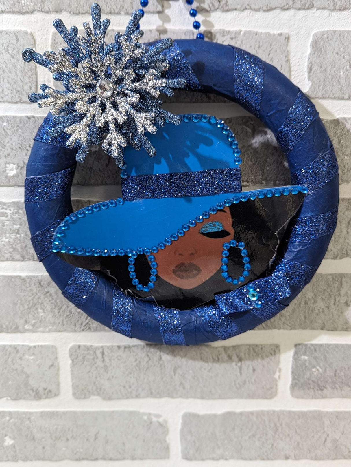 Blue Silver Snow Flakes Design Lady Wreath hung in the wall