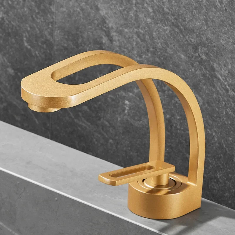 Brass bathroom basin mixer faucet with single handle in gold