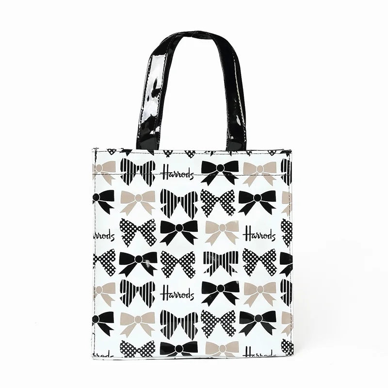 white bag black strap full of ribbons printed design