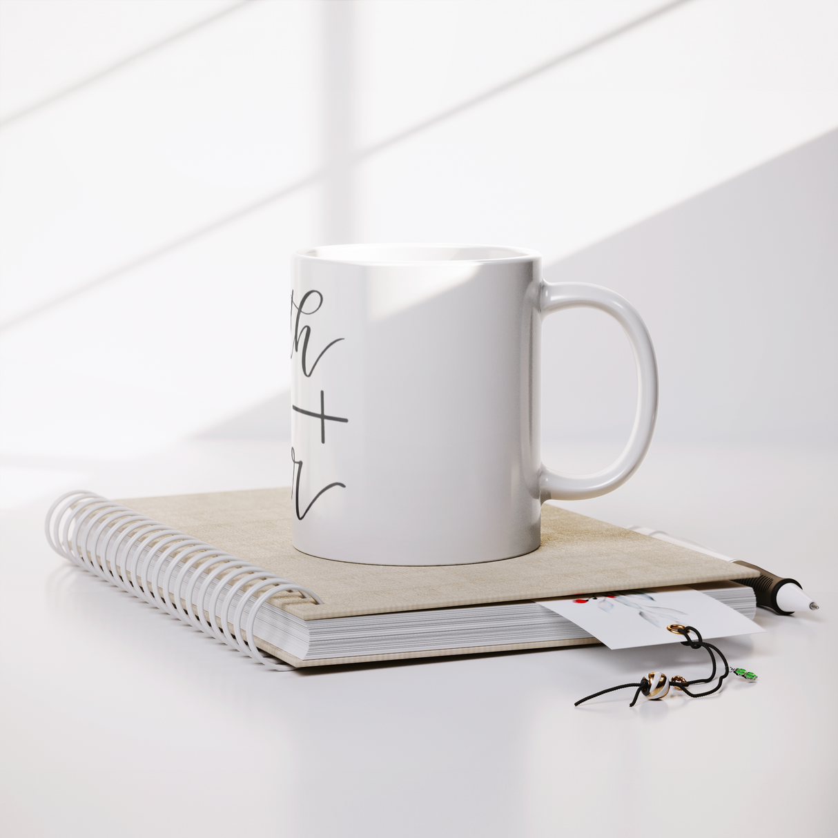 Faith_Over_Fear_Coffee_Mug_Lifestyle_Notebook_Mockup.png