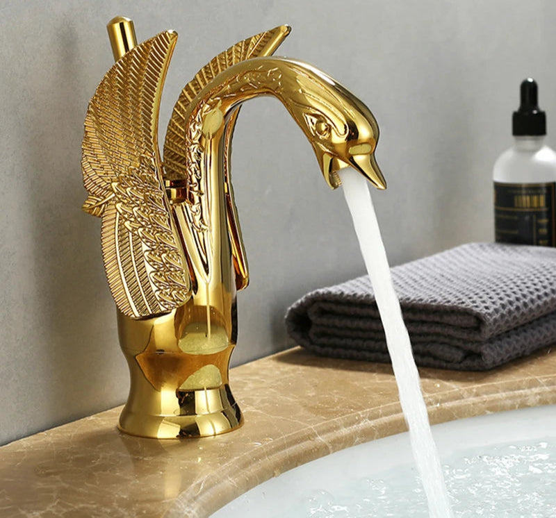 Golden swan-shaped deck-mounted basin faucet with single handle for hot and cold water