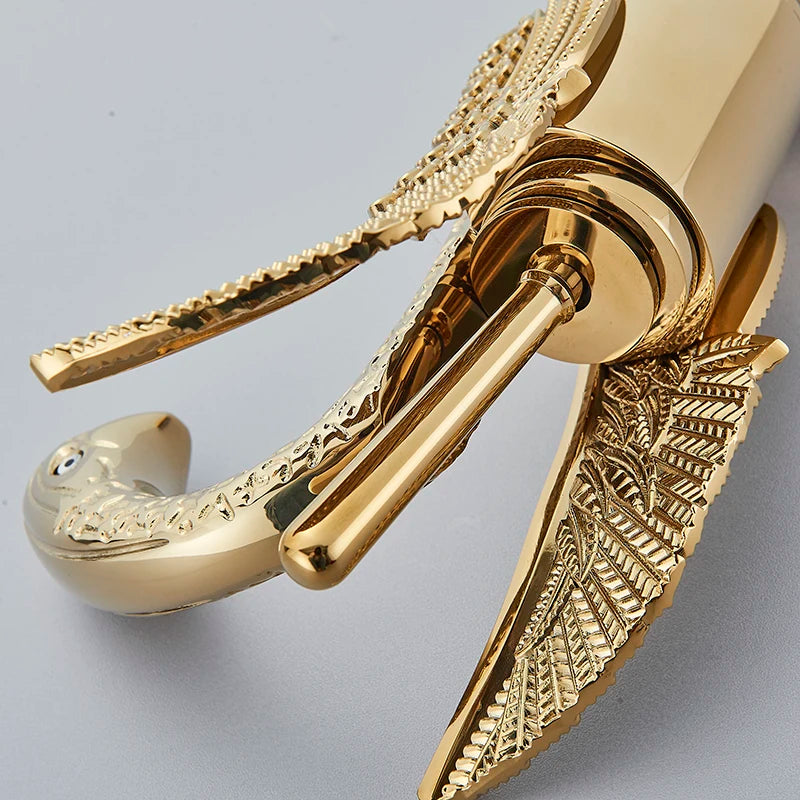 Golden swan-shaped deck-mounted basin faucet with single handle for hot and cold water