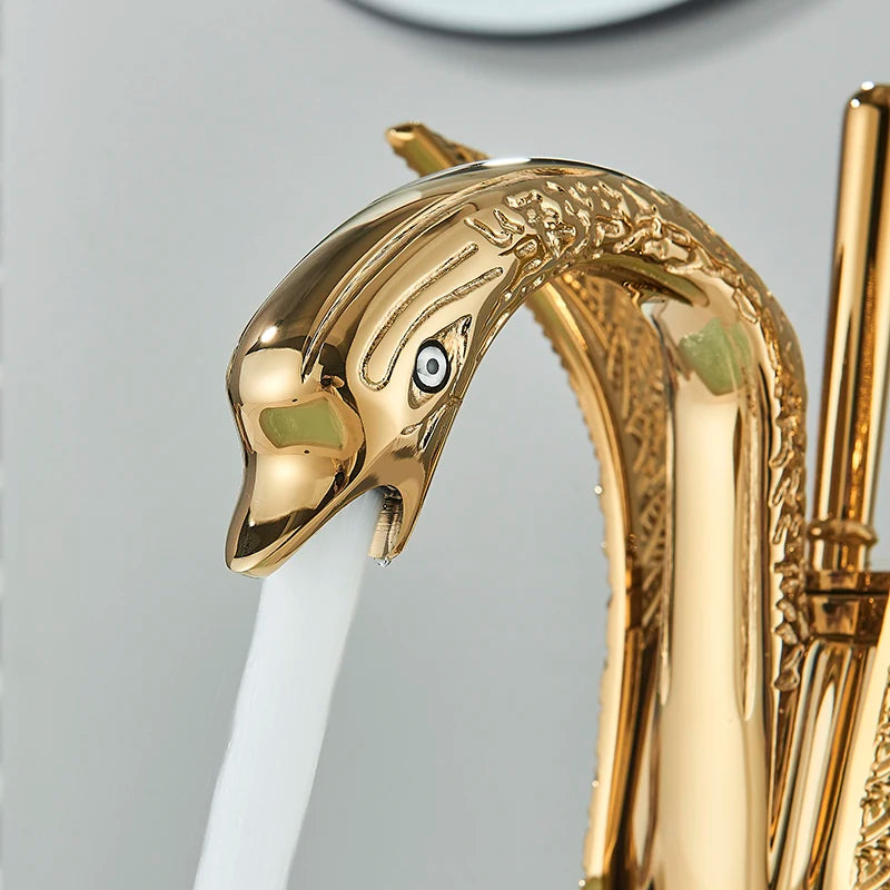 Golden swan-shaped deck-mounted basin faucet with single handle for hot and cold water