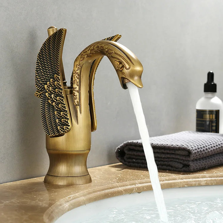 Golden swan-shaped deck-mounted basin faucet with single handle for hot and cold water