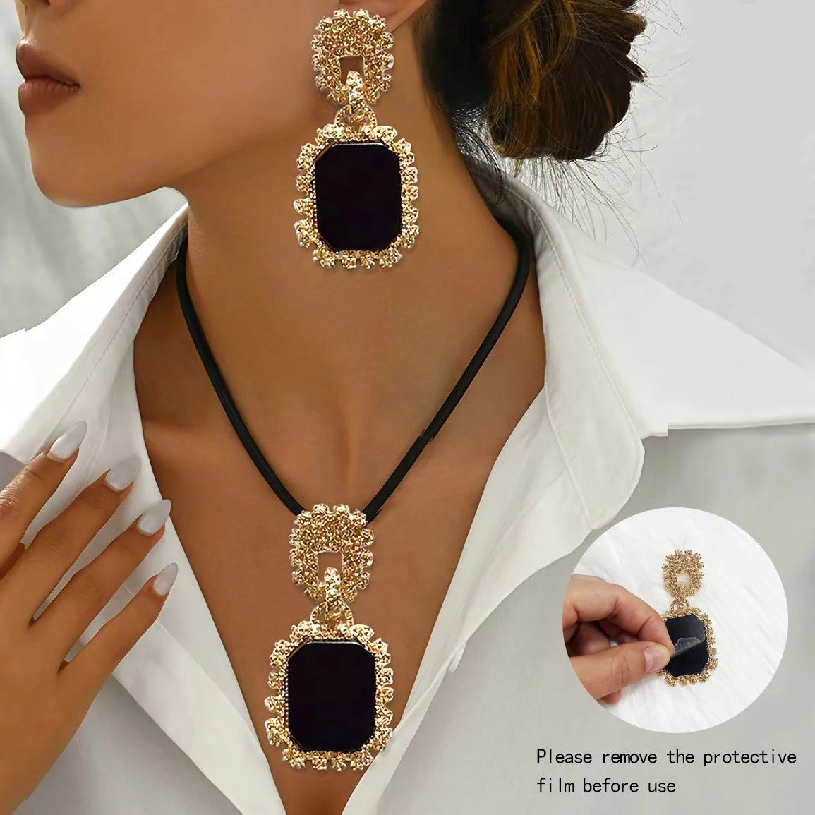 model using black and gold jewelry