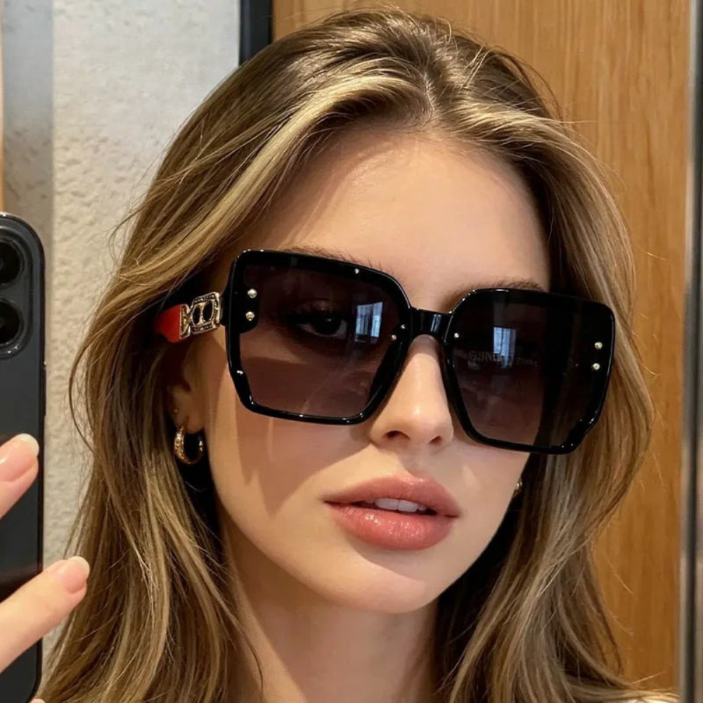 Model Using Luxury UV400 Elegant Women's Sunglasses