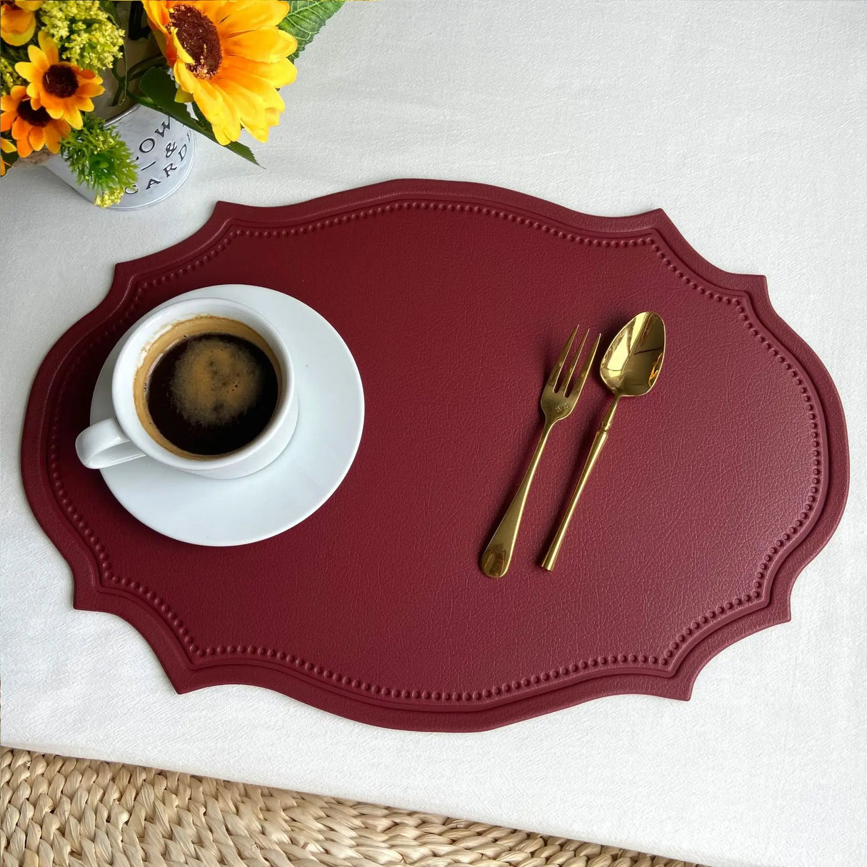 Shaped faux leather PU placemat set in black, pink, and green on a dining table
