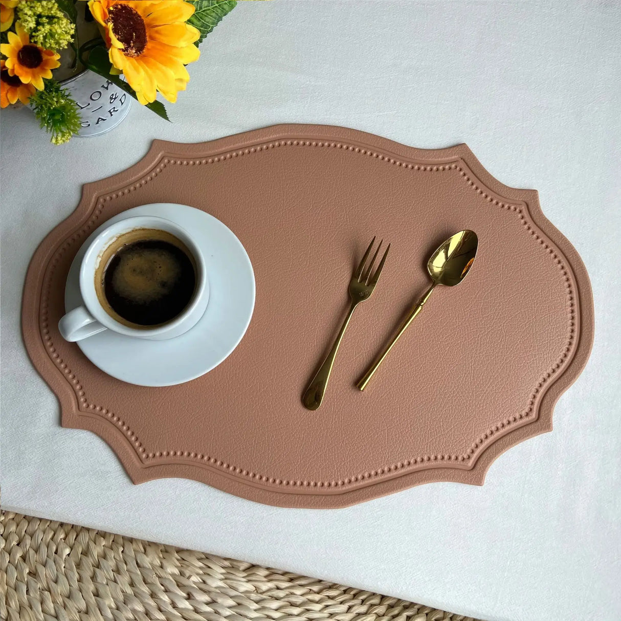 Shaped faux leather PU placemat set in black, pink, and green on a dining table