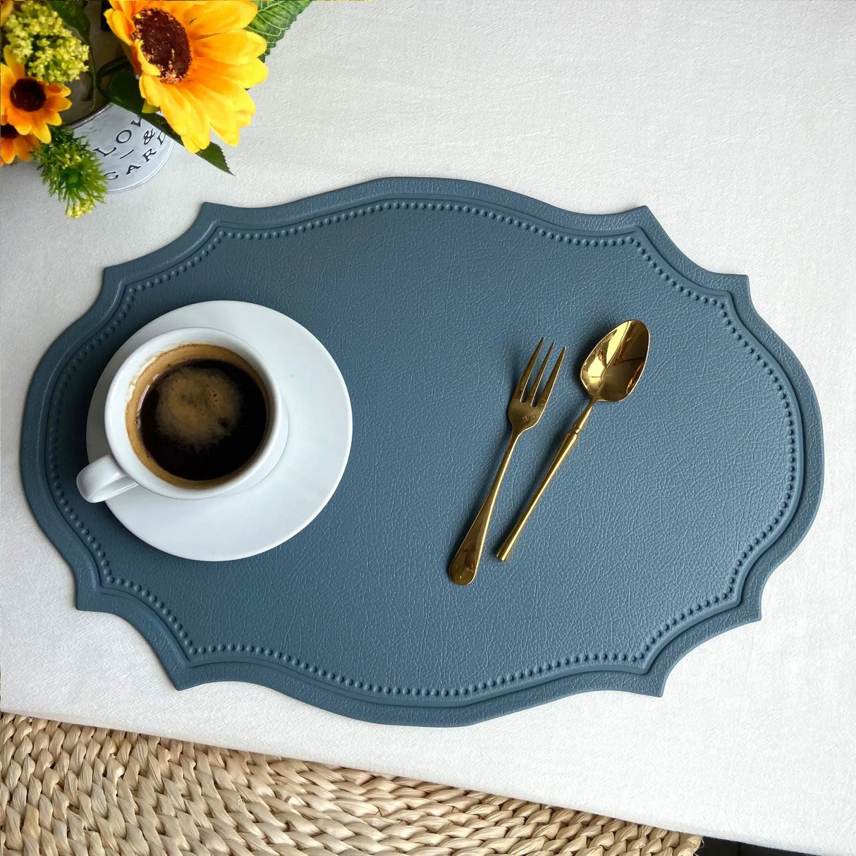 Shaped faux leather PU placemat set in black, pink, and green on a dining table