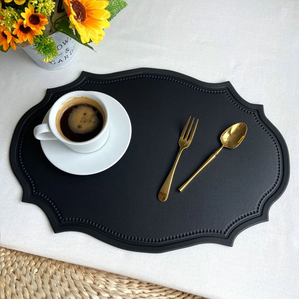 Shaped faux leather PU placemat set in black, pink, and green on a dining table