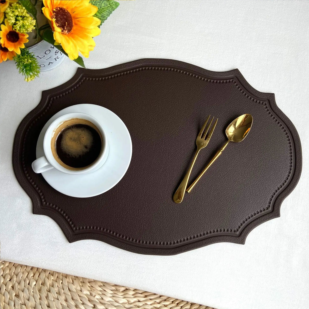 Shaped faux leather PU placemat set in black, pink, and green on a dining table