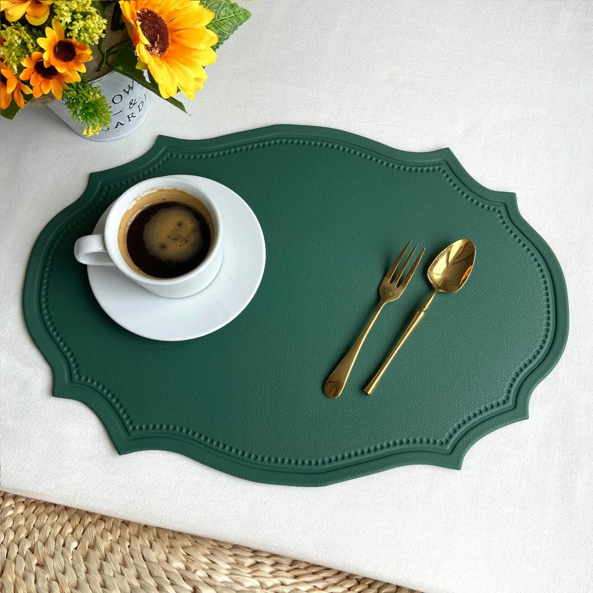 Shaped faux leather PU placemat set in black, pink, and green on a dining table