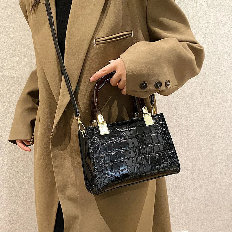 model using black small square bag