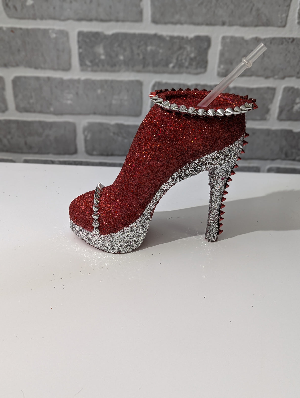 stiletto red silver tumbler cup, grey background