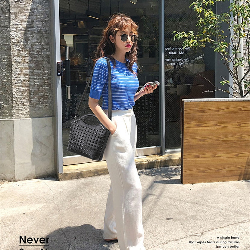 Model using Sheepskin Leather Rivet Handbag