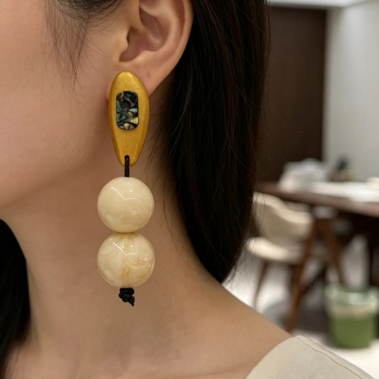 Model Using Vintage-style Niche Beige Resin Beaded Earrings