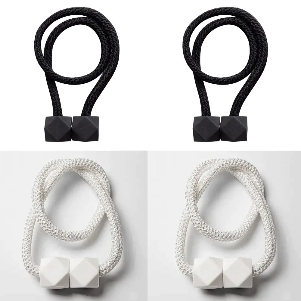 Set of 4 magnetic curtain tiebacks with thick rope design in a living room