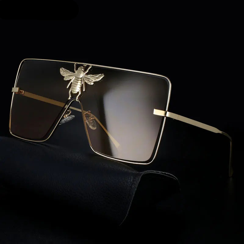 Luxury square metal sunglasses with UV400 protection and bold fashion frame for women.