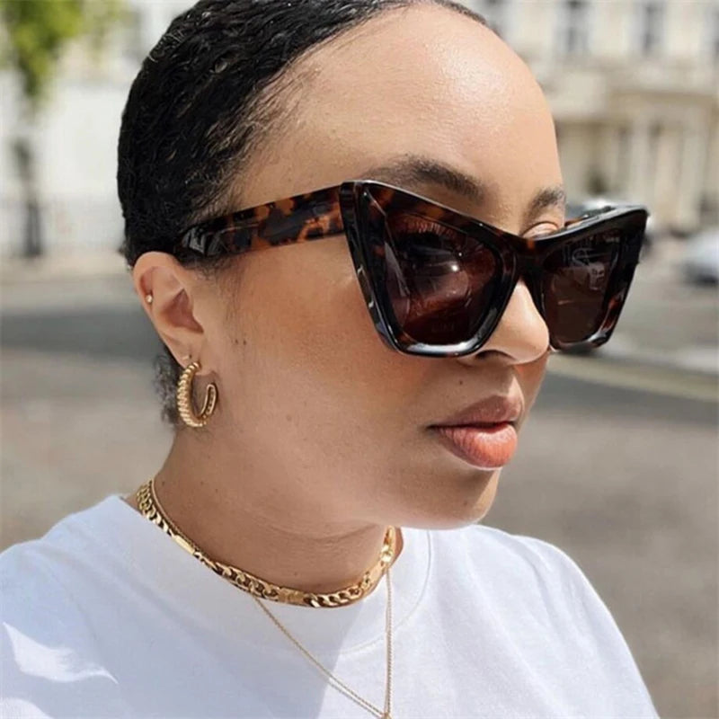 Vintage cat-eye sunglasses with square frame design for women, retro fashion eyewear for outdoor and everyday style.