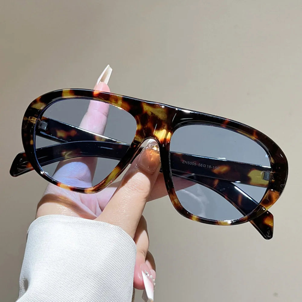 Women’s vintage sunglasses in black and red elegant design, trendy retro outdoor fashion eyewear with UV400 protection.