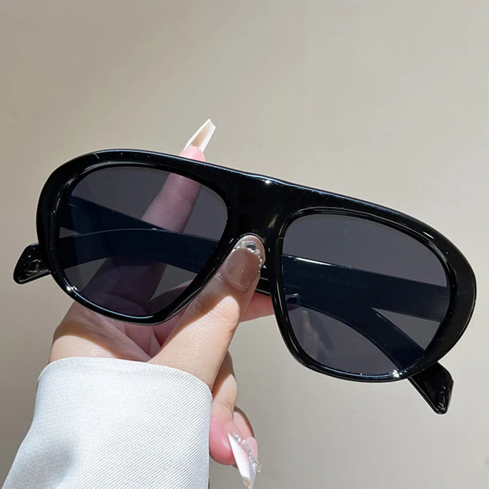 Women’s vintage sunglasses in black and red elegant design, trendy retro outdoor fashion eyewear with UV400 protection.