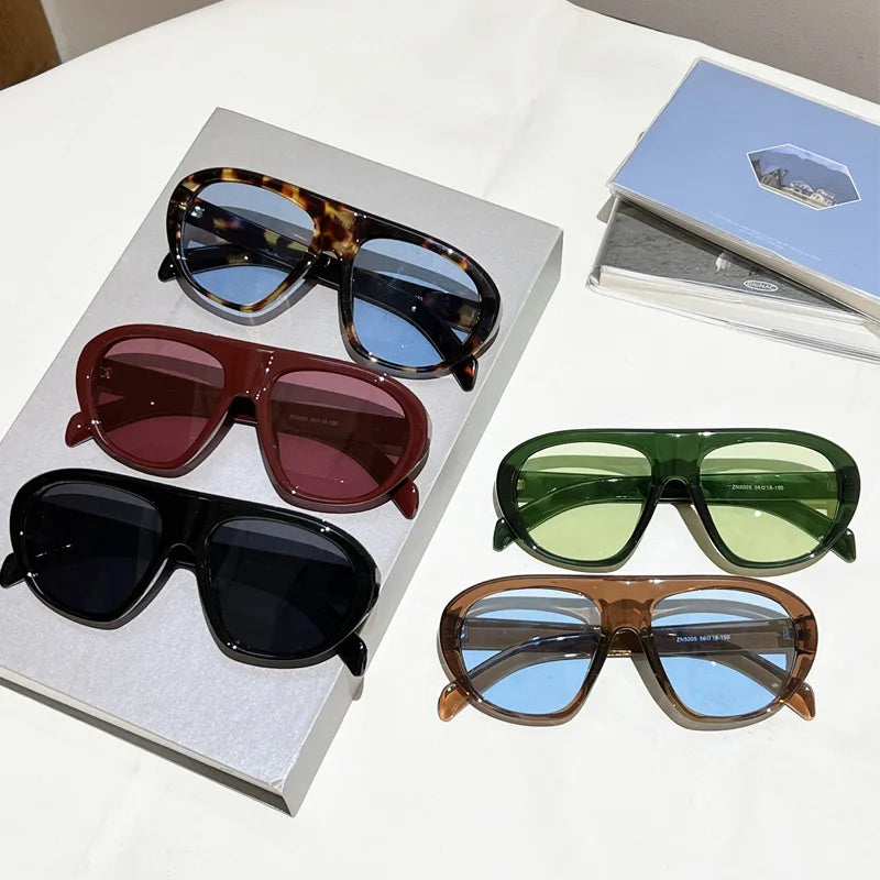 Women’s vintage sunglasses in black and red elegant design, trendy retro outdoor fashion eyewear with UV400 protection.