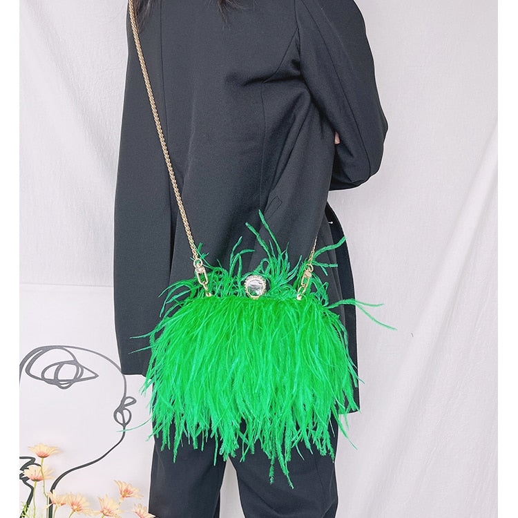Model using Green Ostrich Feather Clutch