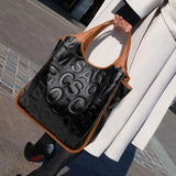 Model using Black Letter Style Large Handbag