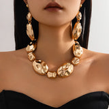 gold necklace and earring
