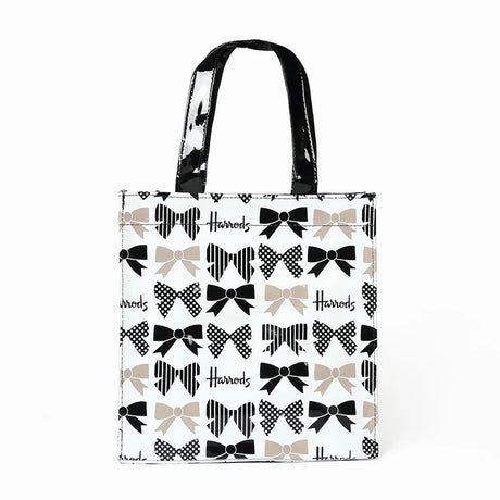 white bag black strap full of ribbons printed design