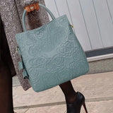 Model using Blue Floral Design Leather Handbag