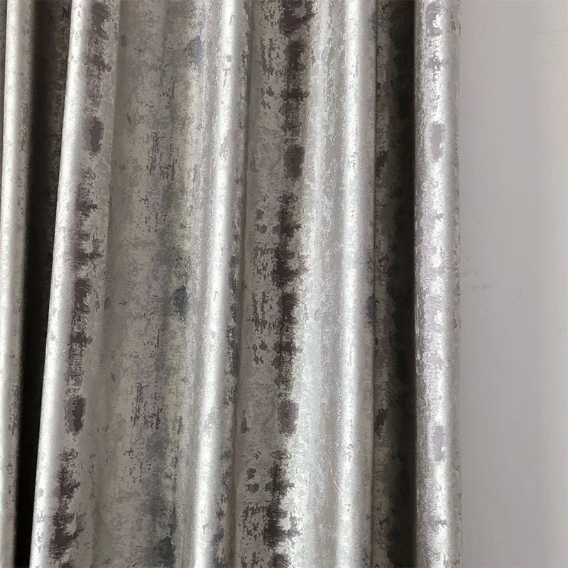 Silver jacquard luxury blackout curtains hanging in a modern living room