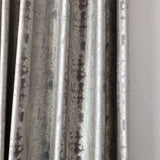 Silver jacquard luxury blackout curtains hanging in a modern living room