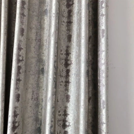 Silver jacquard luxury blackout curtains hanging in a modern living room