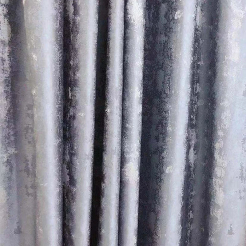 Silver jacquard luxury blackout curtains hanging in a modern living room