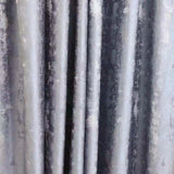 Silver jacquard luxury blackout curtains hanging in a modern living room