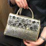 holding gold diamond leather bag