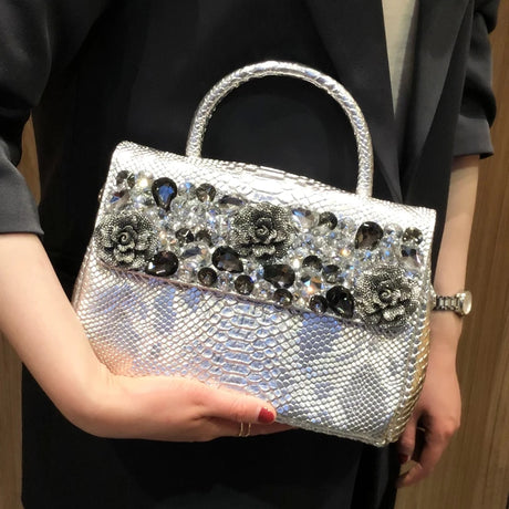 holding white diamond leather bag