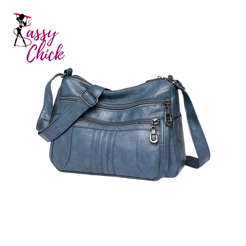 blue leather handbag sassy chick logo