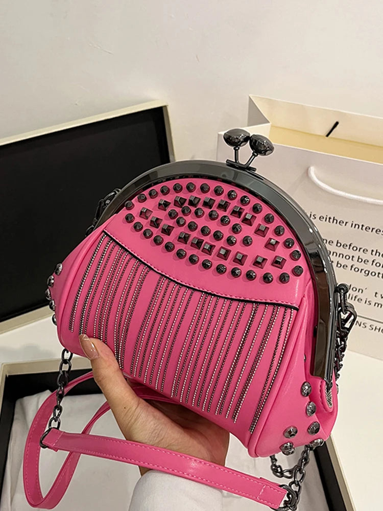 holding pink tassel bag