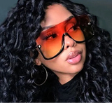 Model Using Oversized Gold Lens Sunglasses