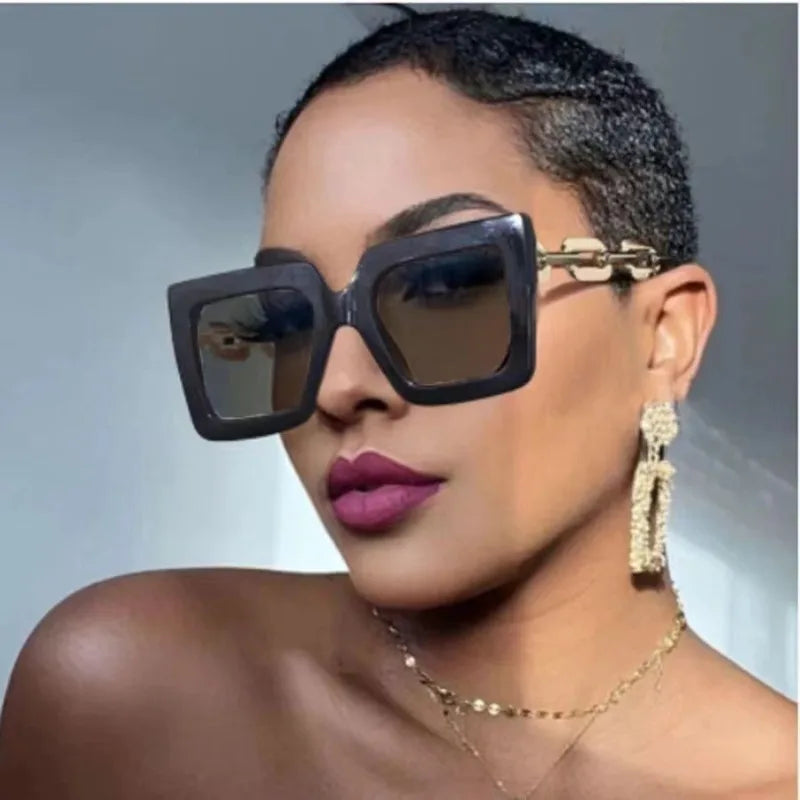 model using black gold square sunglasses