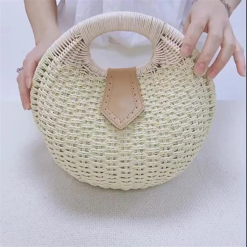 holding White Rattan Handwoven Round Shell Handbag