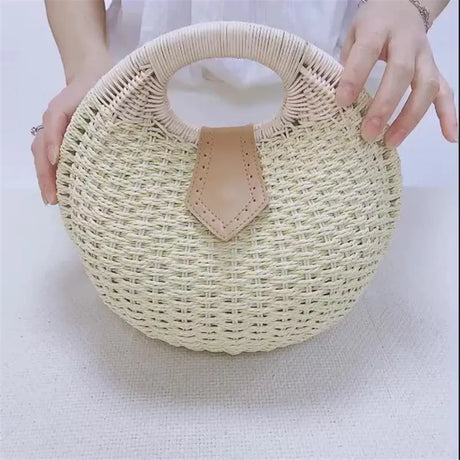 holding White Rattan Handwoven Round Shell Handbag