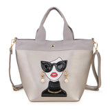 silver woman face design handbag