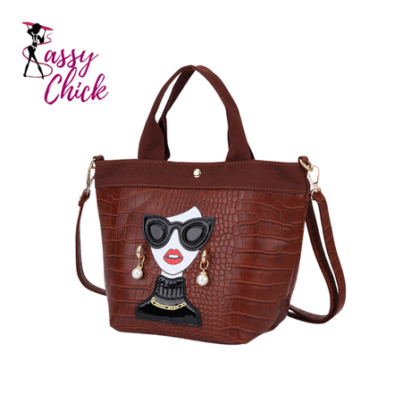 brown woman face design handbag with sassy chick logo