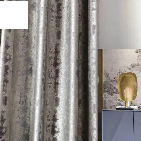 Silver jacquard luxury blackout curtains hanging in a modern living room