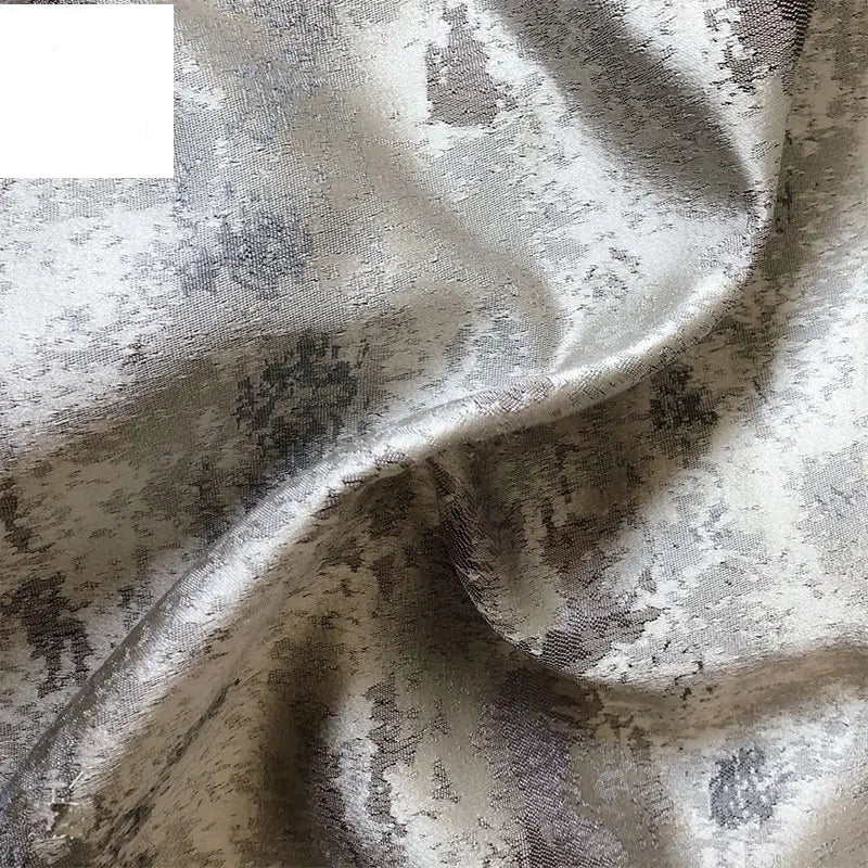 Silver jacquard luxury blackout curtains hanging in a modern living room