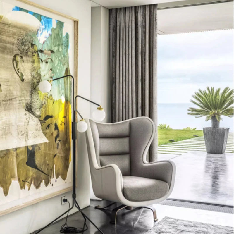 Silver jacquard luxury blackout curtains hanging in a modern living room