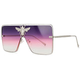 Luxury square metal sunglasses with UV400 protection and bold fashion frame for women.